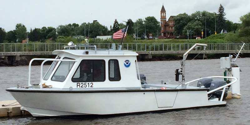 NOAA and Lake Superior Reserve research vessel docked outside Reserve headquarters